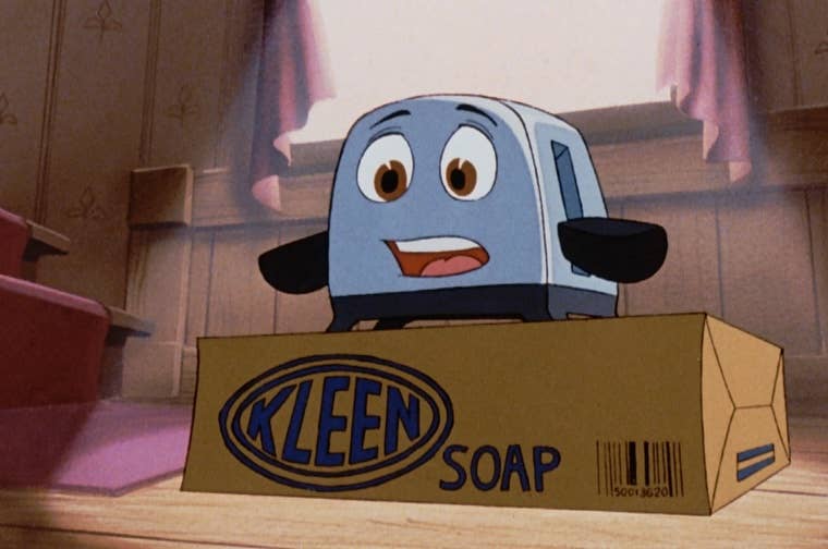 The brave little toaster stands on top of a Kleen Soap box looking shocked at what it sees.